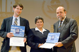 Dan Powell and Sandra Yudice Accept Award